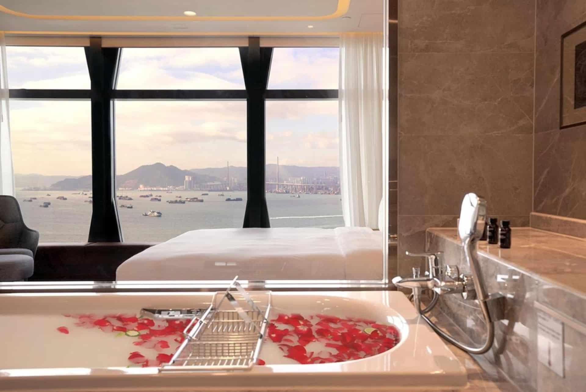 bathtub with a sea view at the one eight one hotel in hong kong