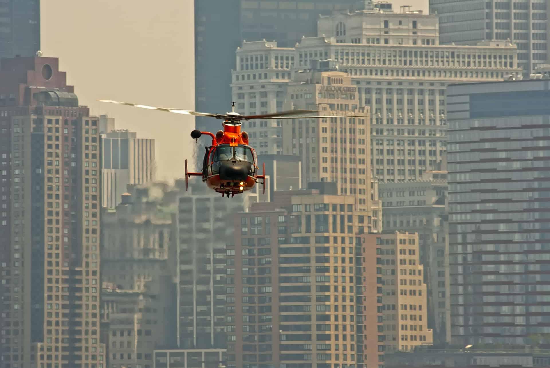 red helicopter flying over New York
